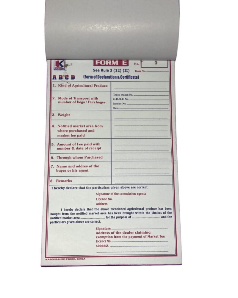 One open white triplicate form book with printed FORM E declaration and lined fields